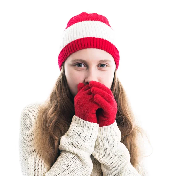 Happiness winter holidays christmas. Teenager concept - smiling young woman in red hat, scarf and over white background. Stock Photo