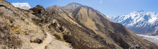 Trekking in Himalaya mountains with snow peaks