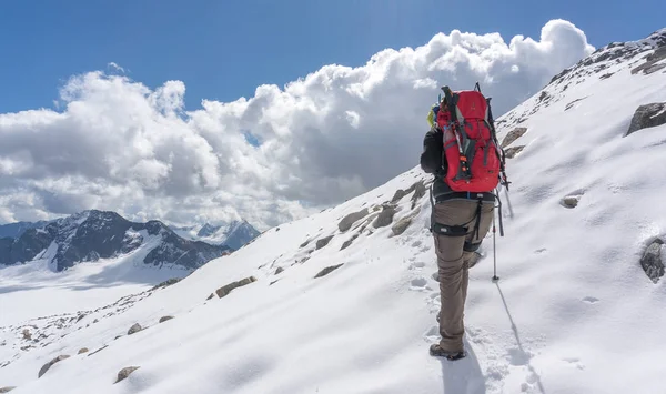 Hiking to mountain summit on snow glacier extreme trek