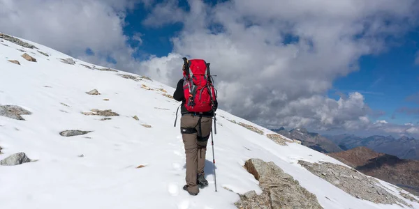 Hiking to mountain summit on snow glacier extreme trek