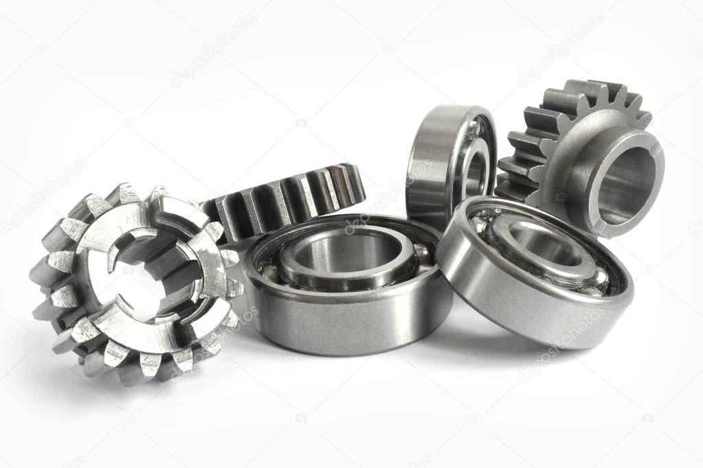 Gears and bearings on the white background.