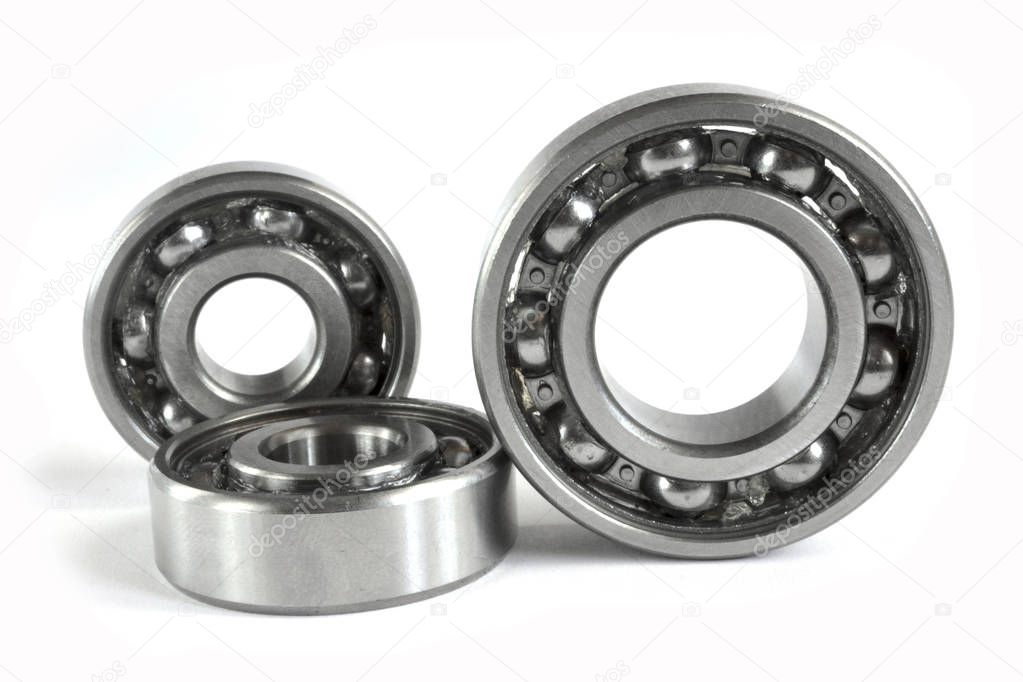 Three close-up bearings on the white background.