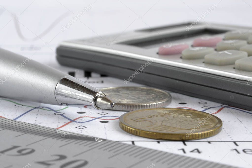 Coins, graph, ruler, pen and calculator