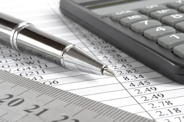 Table, ruler and calculator — Stock Photo, Image