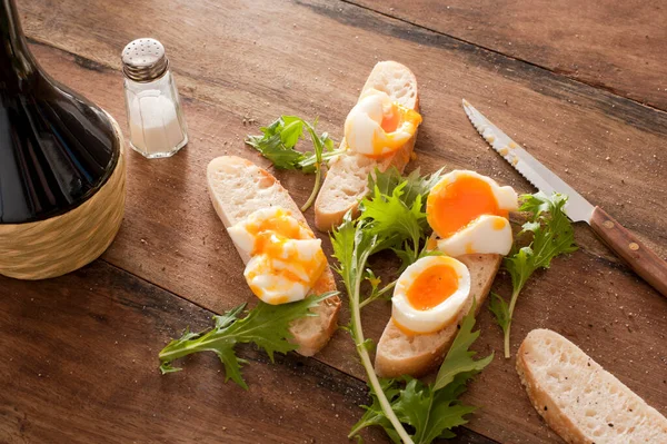 Fresh Rolls Boiled Eggs Rocket Lying Wooden Table Salt Knife — Stock Photo, Image