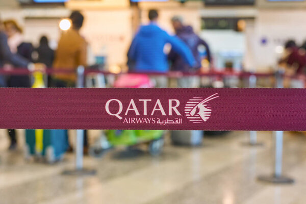 MILAN MALPENSA, ITALY - CIRCA NOVEMBER, 2017: close up shot of Qatar Airways sign at check-in area at Milan-Malpensa airport, Terminal 1. 