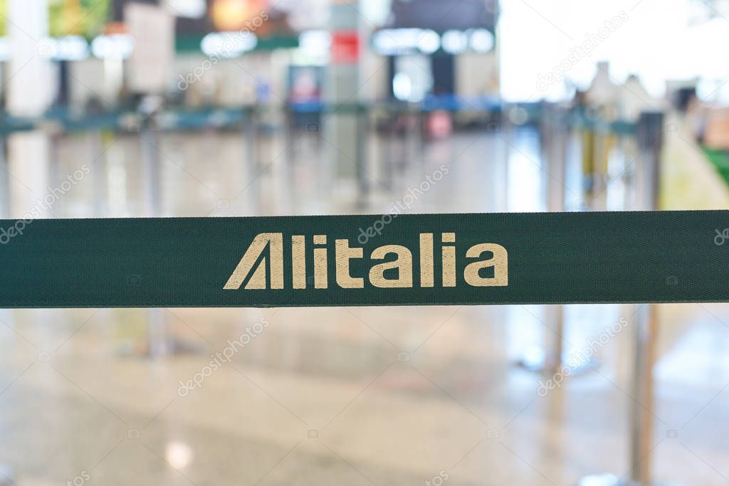 MILAN MALPENSA, ITALY - CIRCA NOVEMBER, 2017: close up shot of Alitalia sign at Milan-Malpensa airport.