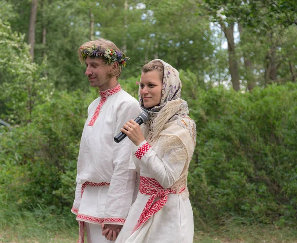 portrait of newlyweds in traditional russian clothes