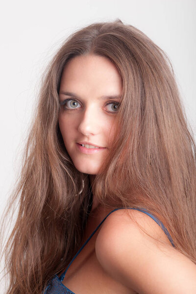 studio portrait of a girl with long hair