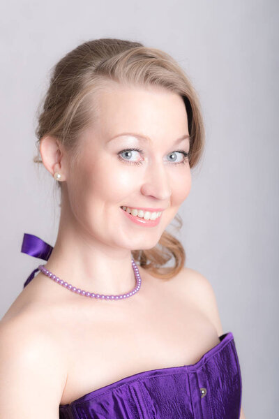 studio portrait of a smiling girl close up