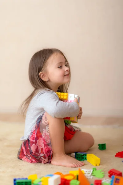 Happy girl with toys — Stock Photo, Image