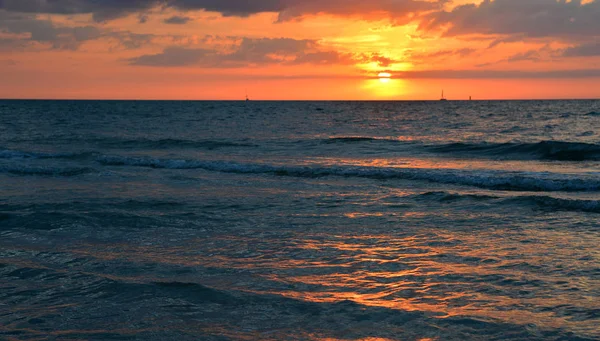 Sunset in the evening on a sea beach