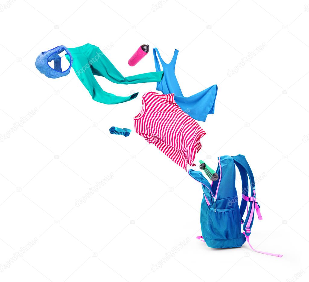 Backpack with colorful things that fly out of it, isolated on a white background