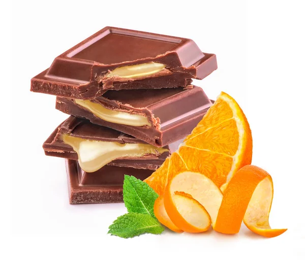 Pieces of black chocolate with orange filling on a white backgro — Stock Photo, Image