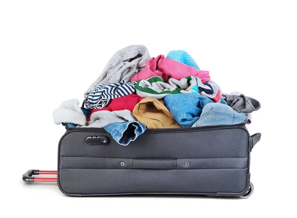 Open suitcase with clothing isolated on a white — Stock Photo, Image