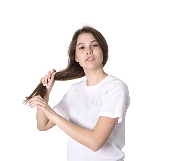 Junge Frauen halten Haare in Händen — Stockfoto