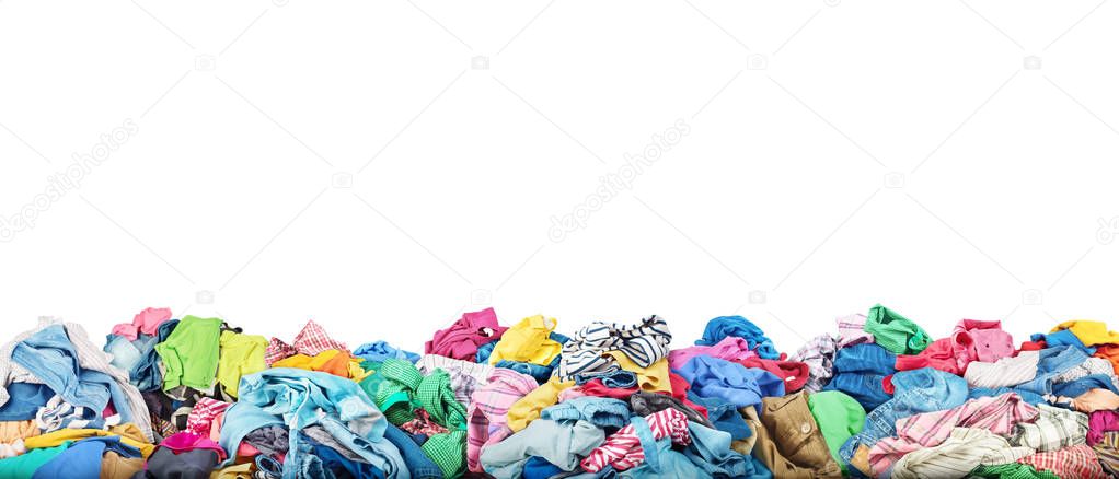 Concept of sale. Big pile of clothes on a white background. Dona