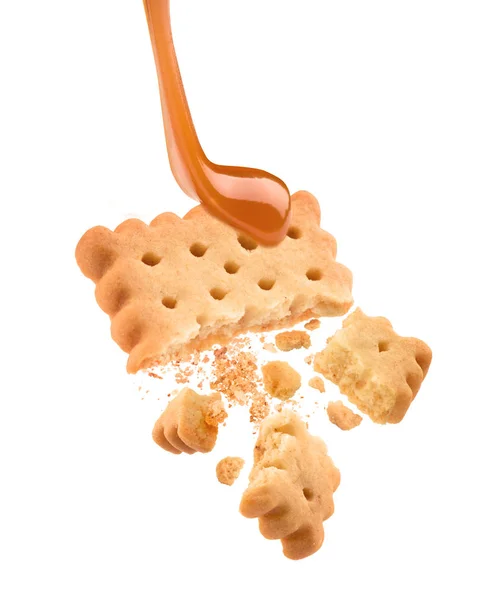 Broken caramel cookies on white background — Stock Photo, Image