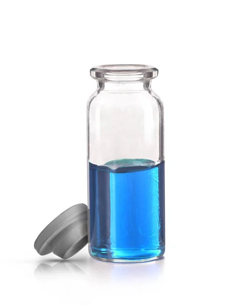 Lékařská láhev s modrou tekutinou a nádobou — Stock fotografie