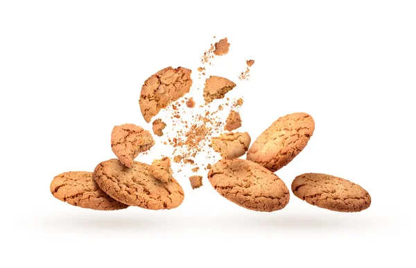Söta kakor i dynamik på vit bakgrund — Stockfoto