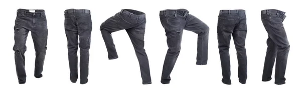 Ensemble de pantalons denim vides foncés sur fond blanc — Photo