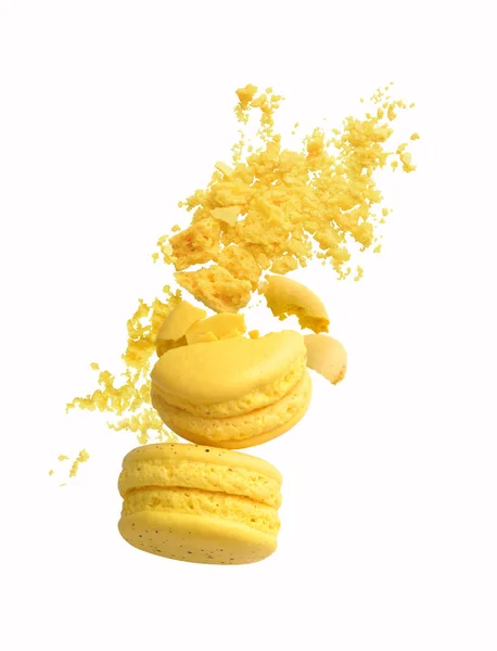 Crushed yellow macaroons on a white background — Stock Photo, Image