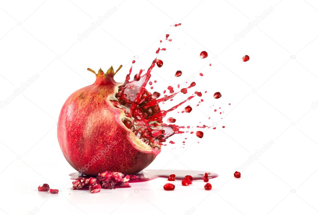 Pomegranate explosion juice seeds on a white background