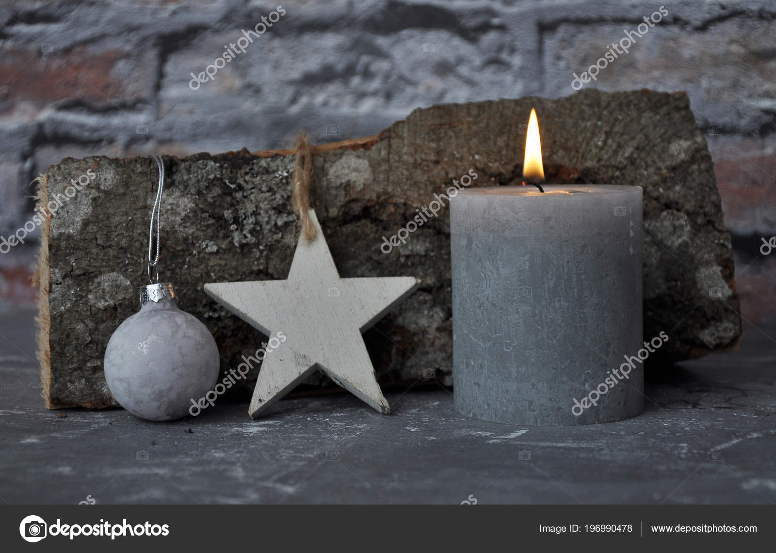 Burning Candle Decoration Wood Billet Front Brick Wall Stock