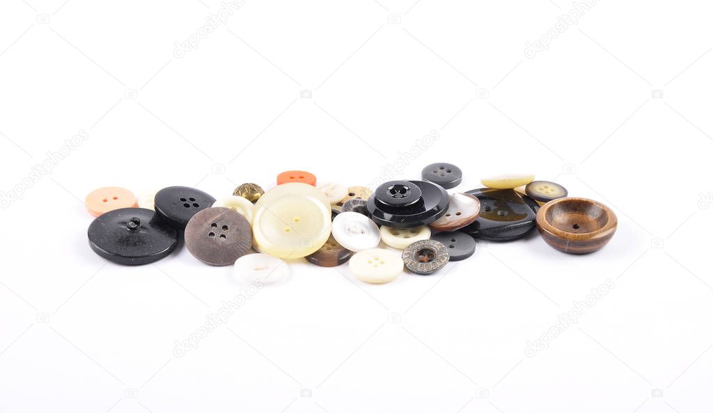 Old buttons on white background