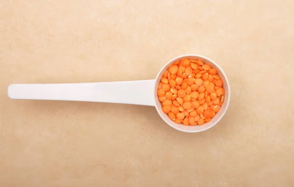 Red Lentils Measuring Spoon Brown Background — Stock Photo, Image