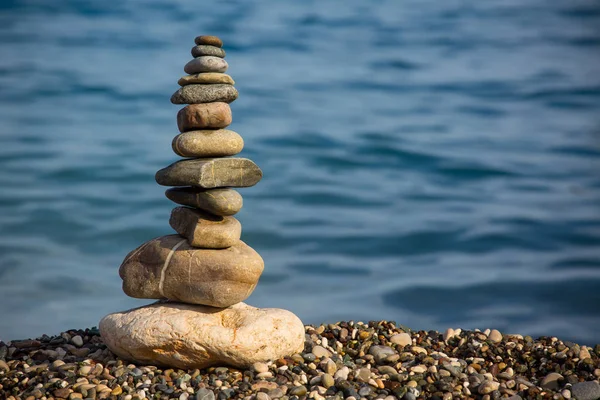 Scales of stones against the background of the sea — Stock Image Scales of stones against the background of the sea Stock Photo