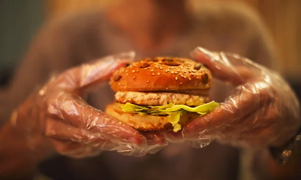 Young Woman Eating Tasty Burger Cafe Close — Stock Photo, Image