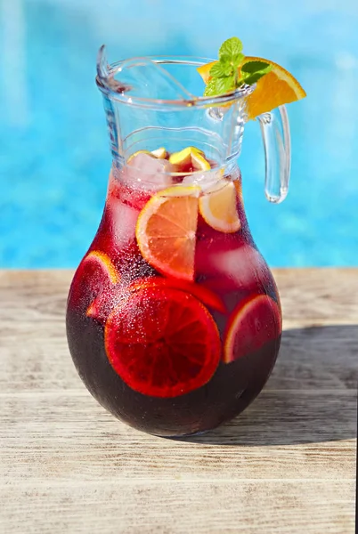 Glass Jug Iced Sangria Strawberry Orange Apple Lemon Pool — Stock Photo, Image