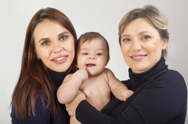 Grandmother, daughter and granddaughter on white portrait, happy family concep