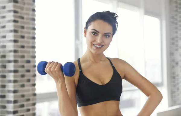 Young attractive sportswoman doing fitness exercises — Stock Photo, Image