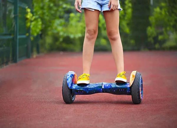 Feet of the little girl riding on a segway — Stock Photo, Image