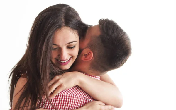 Young tattooed stylish couple hugging in bedroom — Stock Photo, Image