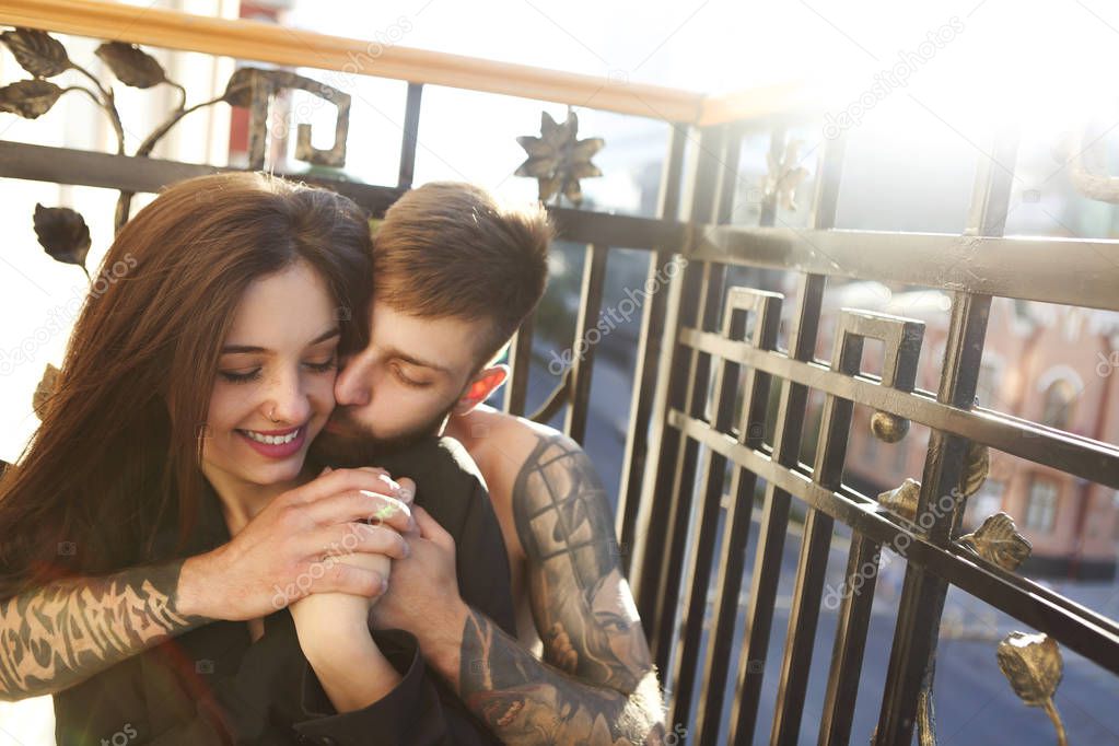 Young tattooed stylish couple in love