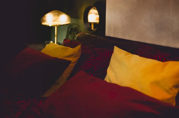 Comfortable Bed Various Pillows Cozy Dark Bedroom Retro Interior Glowing — Stock Photo, Image