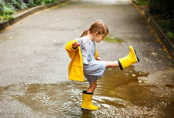 Little Girl Wearing Yellow Boots Coat Jumping Rainy Day — Stock Photo, Image