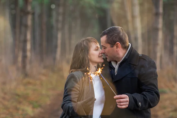 Handsome Man Woman Warm Clothes Outstretching Hands Burning Sparkles Blurred — Stock Photo, Image