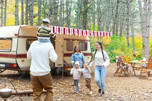 Portrait Young Smiling Family While Hugging House Wheels Outdoors — Stock Photo, Image