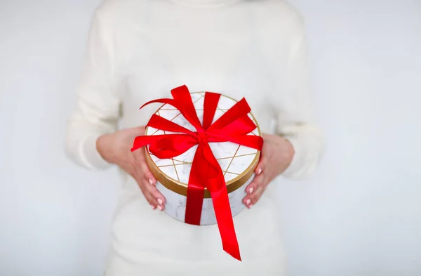 Unrecognizable Girl White Sweater Holding Present Box Tied Bright Red — Stock Photo, Image