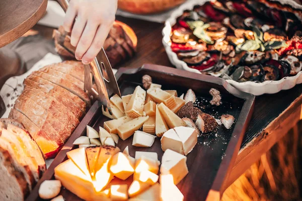 High Angle Crop Anonymous Person Tongs Taking Piece Cheese Tray — Stock Photo, Image