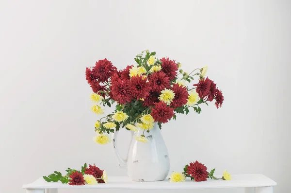 still life with chrysanthemums on white background