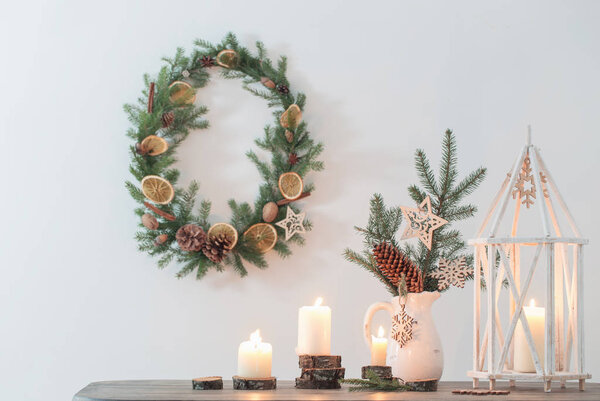 Christmas decoration with candles  on background white wall