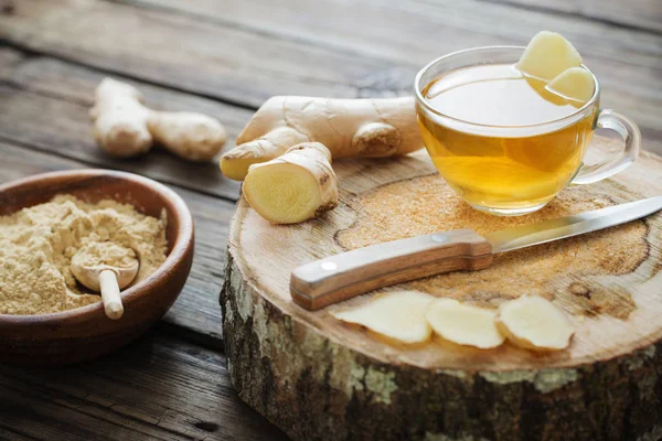 Ginger tea on old wooden background — Stock Photo, Image
