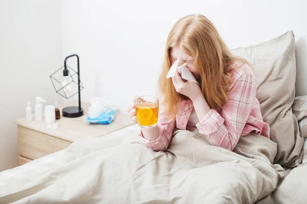 Sick girl with  cup of tea with lemon and ginger — Stock Photo, Image