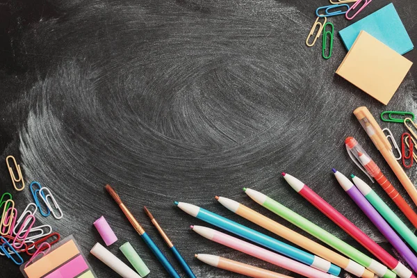 School supplies on  blackboard — Stock Photo, Image