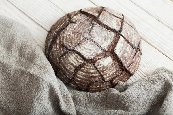 Homemade bread on  white wooden background — Stockfoto